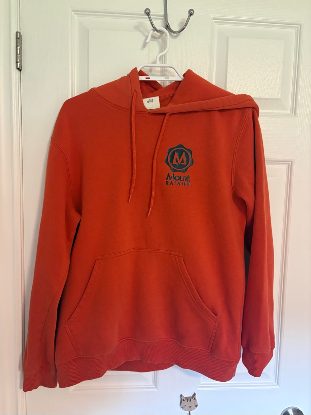 H&M Men’s Orange Crewneck Hoodie with Mount Rainier Logo